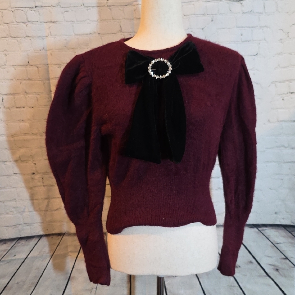 Zara burgundy fuzzy knit sweater featuring a black velvet bow and a rhinestone b